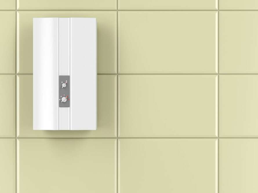 A sleek tankless hot water heater mounted on the bathroom wall.
