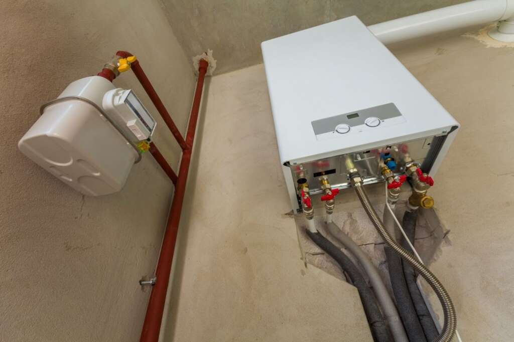 Low view of a tankless water heater.