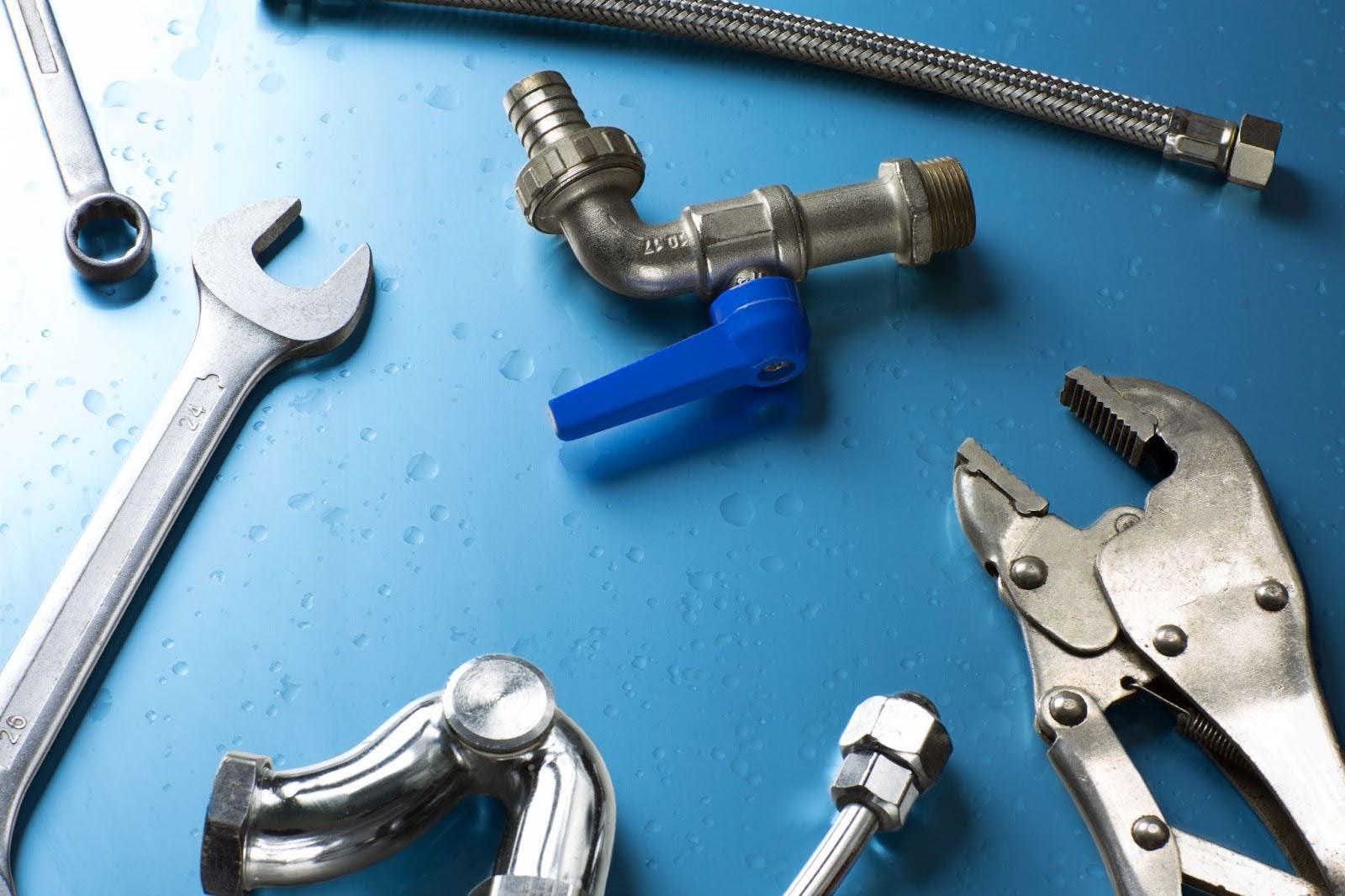 A set of plumbing tools on the table.